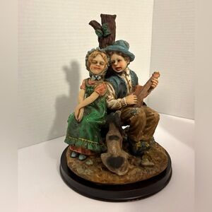 Resin Figurine of a Couple with Dog